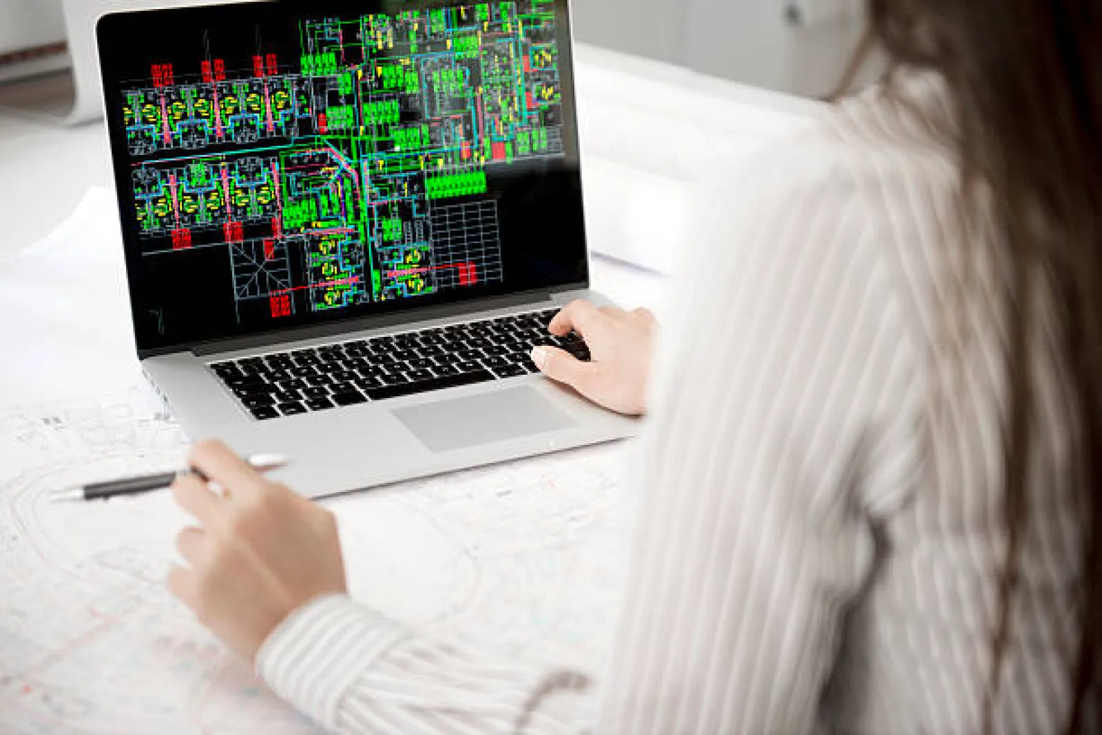 Physical PCB being inspected for reverse engineering documentation