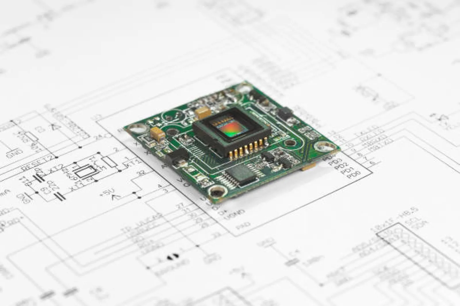 Engineer reviewing a circuit schematic on screen