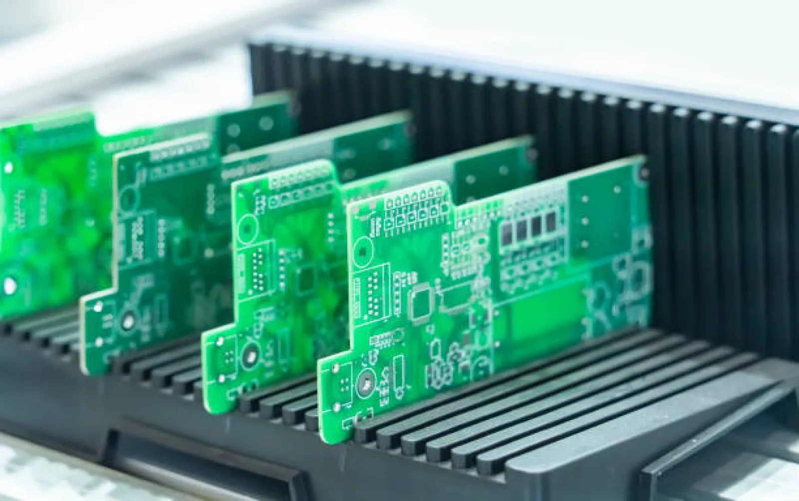 Industrial-scale stack of bulk manufactured PCBs ready for shipment