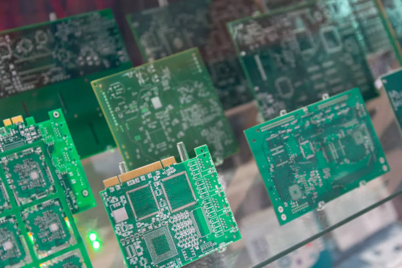 Double-sided printed circuit board showing plated through-holes and dual-layer copper traces